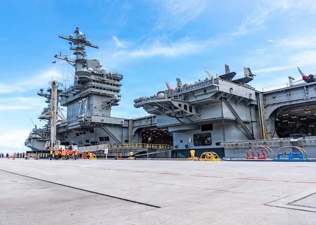 Nimitz-class aircraft carrier USS George Washington (CVN 73) is moored on the pier after arriving at Naval Station Guam, June 16, 2026. The George Washington Carrier Strike Group is operating in the U.S. 7th Fleet area of operations. George Washington is the U.S. Navy’s premiere forward-deployed aircraft carrier, a long-standing symbol of the United States’ commitment to maintaining a free and open Indo-Pacific, while operating alongside allies and partners across the U.S. Navy’s largest numbered fleet. (U.S. Navy photo by Mass Communication Specialist 2nd Class Tyler Crowley)