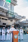 Capt. Nicholas DeLeo, commanding officer of Nimitz-class aircraft carrier USS George Washington (CVN 73) speaks to Gaum media pierside after arriving at Naval Station Guam, June 16, 2025. George Washington is the U.S. Navy’s premiere forward-deployed aircraft carrier, a long-standing symbol of the United States’ commitment to maintaining a free and open Indo-Pacific, while operating alongside allies and partners across the U.S. Navy’s largest numbered fleet. (U.S. Navy photo by Mass Communication Specialist 3rd Class Roselia Garcia)