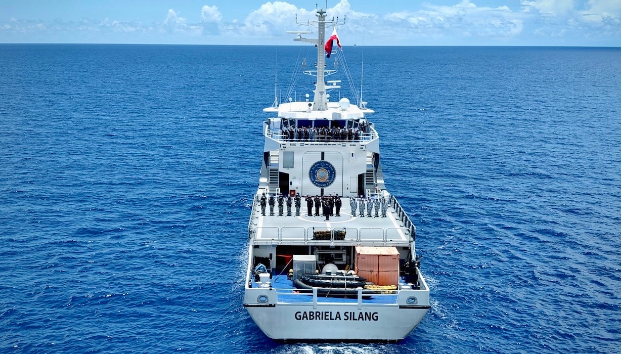 Members of the Philippine Coast Guard’s BRP Gabriela Silang stand for a photo during a joint sail offshore of Guam on June 12, 2026, during a mutual exchange.