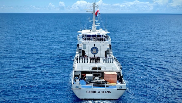 Members of the Philippine Coast Guard’s BRP Gabriela Silang stand for a photo during a joint sail offshore of Guam on June 12, 2026, during a mutual exchange.