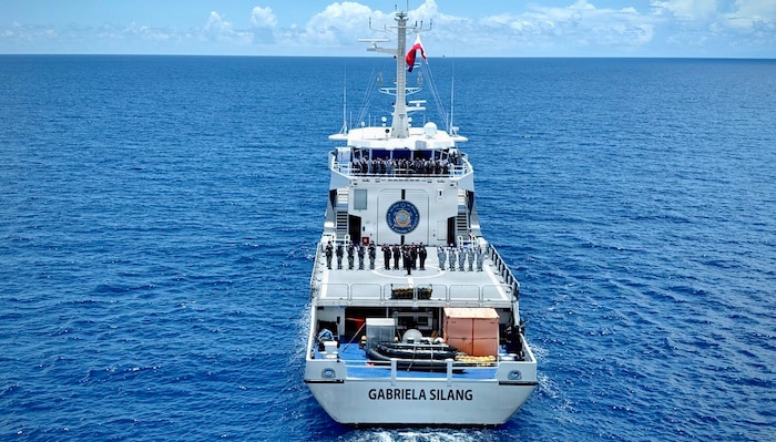 Members of the Philippine Coast Guard’s BRP Gabriela Silang stand for a photo during a joint sail offshore of Guam on June 12, 2026, during a mutual exchange.