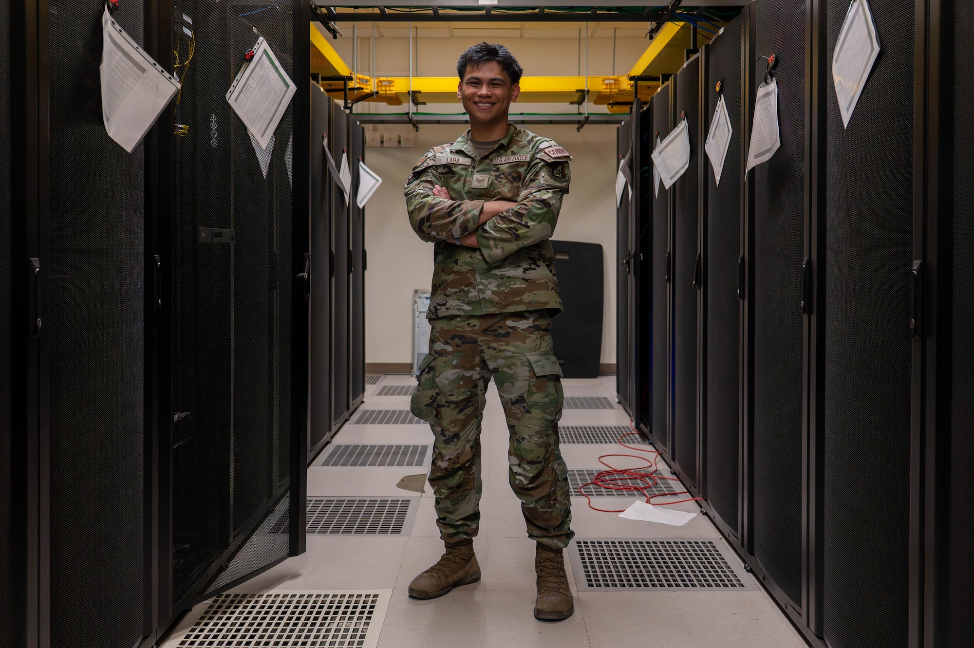 U.S. Air Force Airman 1st Class Allison Hinkle, 8th Communications Squadron radio technician, poses in a server room at Kunsan Air Base, Republic of Korea, June 17, 2026. Lara was selected as the Wolf Pack’s Pride of the Pack for the week of June 15-19 June due to his achievements within his career field and his impact on the readiness and well-being of the Wolf Pack. (U.S. Air Force photo by Staff Sgt. Cedrique Oldaker)