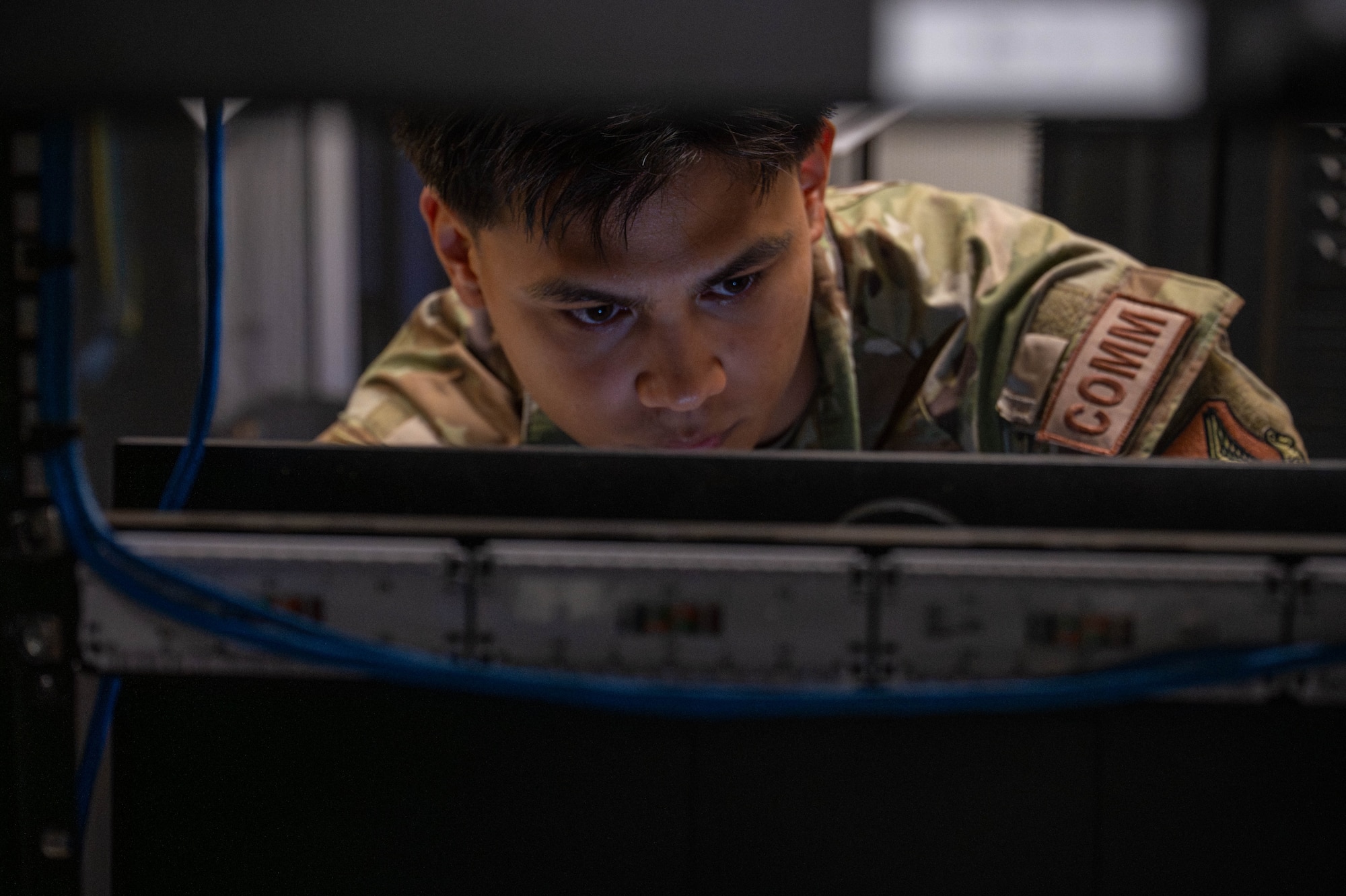 U.S. Air Force Senior Airman Lowen Lara, 8th Communications Squadron systems administration technician, checks system information at Kunsan Air Base, Republic of Korea, June 17, 2026. Lara was selected as the Wolf Pack’s Pride of the Pack for the week of June 15- 19 June due to his achievements within his career field and his impact on the readiness and well-being of the Wolf Pack. (U.S. Air Force photo by Staff Sgt. Cedrique Oldaker)