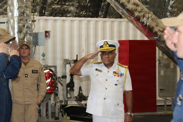 Sri Lanka Navy Rear Adm. Jagath Kumara, commander, Western Naval Area, salutes the watch aboard Independence-class littoral combat ship USS Canberra, June 14, 2026. Canberra is conducting routine operations in the U.S. 7th Fleet area of operations. (U.S. Navy photo by Operations Specialist 1st Class Anthony Wade).