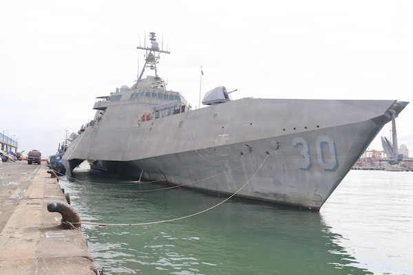 Sri Lanka Navy Rear Adm. Jagath Kumara, commander, Western Naval Area, salutes the watch as he arrives aboard Independence-variant littoral combat ship USS Canberra (LCS 30). Canberra is conducting routine operations in the U.S. 7th Fleet area of operations. (U.S. Navy photo by Operations Specialist 1st Class Anthony Wade).