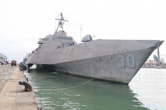 Sri Lanka Navy Rear Adm. Jagath Kumara, commander, Western Naval Area, salutes the watch as he arrives aboard Independence-variant littoral combat ship USS Canberra (LCS 30). Canberra is conducting routine operations in the U.S. 7th Fleet area of operations. (U.S. Navy photo by Operations Specialist 1st Class Anthony Wade).