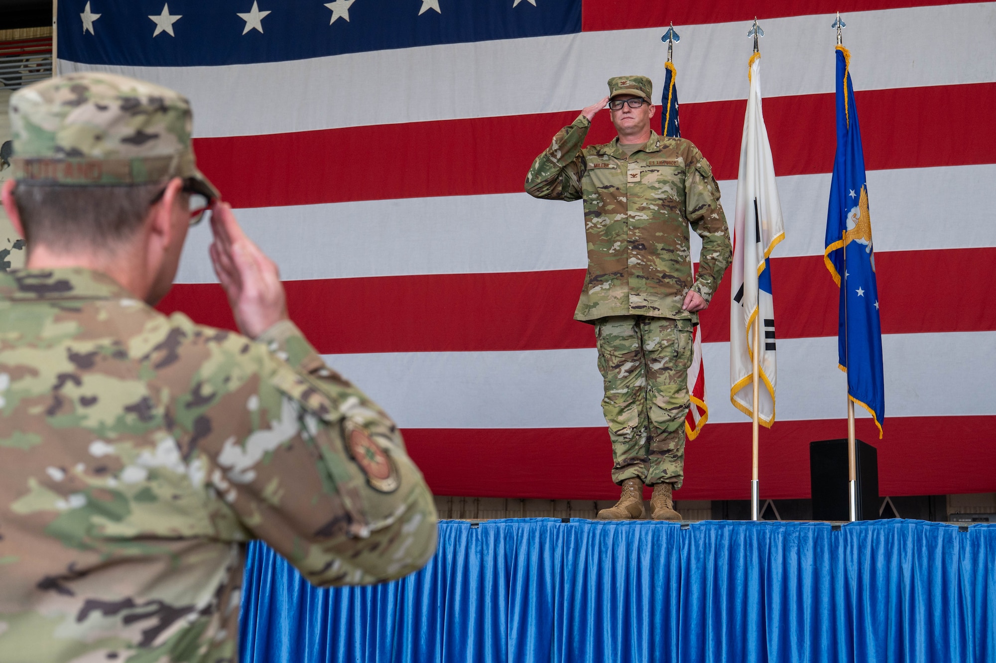 U.S. Air Force Col. Joshua Miller, incoming 8th Medical Group commander, renders his first salute to Airmen of the group during the 8th MDG change of command ceremony at Kunsan Air Base, Republic of Korea, June 24, 2026. The first salute is a traditional military custom that signifies the assumption of leadership and the transfer of authority to the incoming commander. (U.S. Air Force photo by Staff Sgt. Cedrique Oldaker)