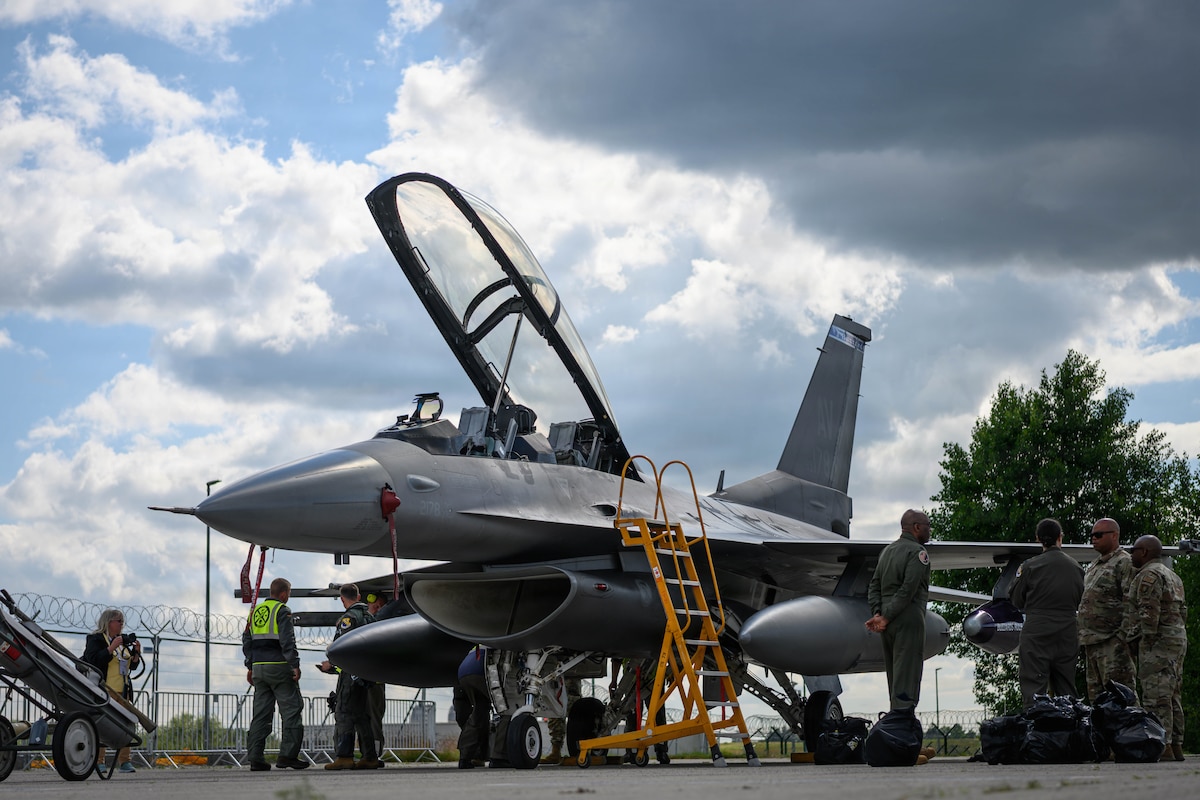 U.S. Air Force and German military crew members conduct post-flight checks on an F-16D Fighting Falcon assigned to the 31st Fighter Wing before the ILA Berlin Air Show June 9, 2026, at Berlin-Brandenburg Airport, Germany.