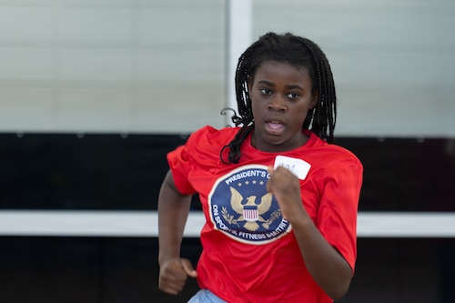 A military child runs during the shuttle run portion of the Presidential Fitness Test pilot event at MacDill Air Force Base, Florida, June 12, 2026.