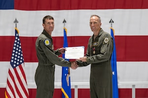 men holding certificate