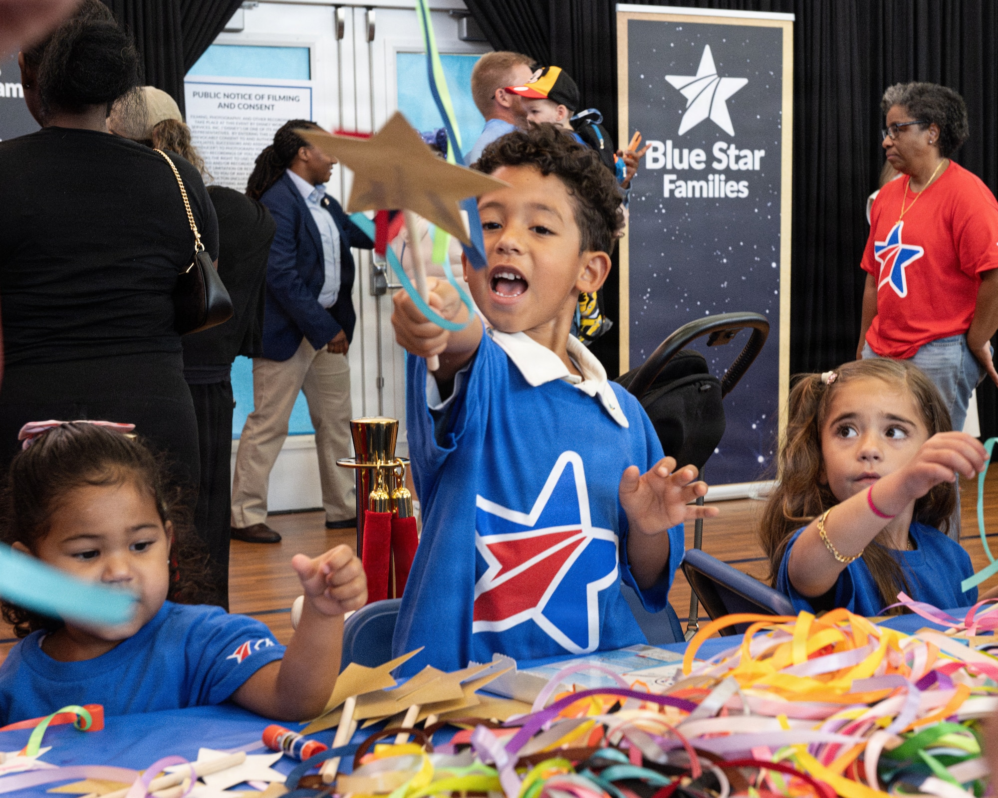 Children of military families participate in arts and crafts activities during a Blue Star Books event with Disney at MacDill Air Force Base, Florida, June 16, 2026. Approximately 125 children received books and gifts, and had the opportunity to participate in family activities during the event. (U.S. Air Force photo by Airman 1st Class Helen Ly)