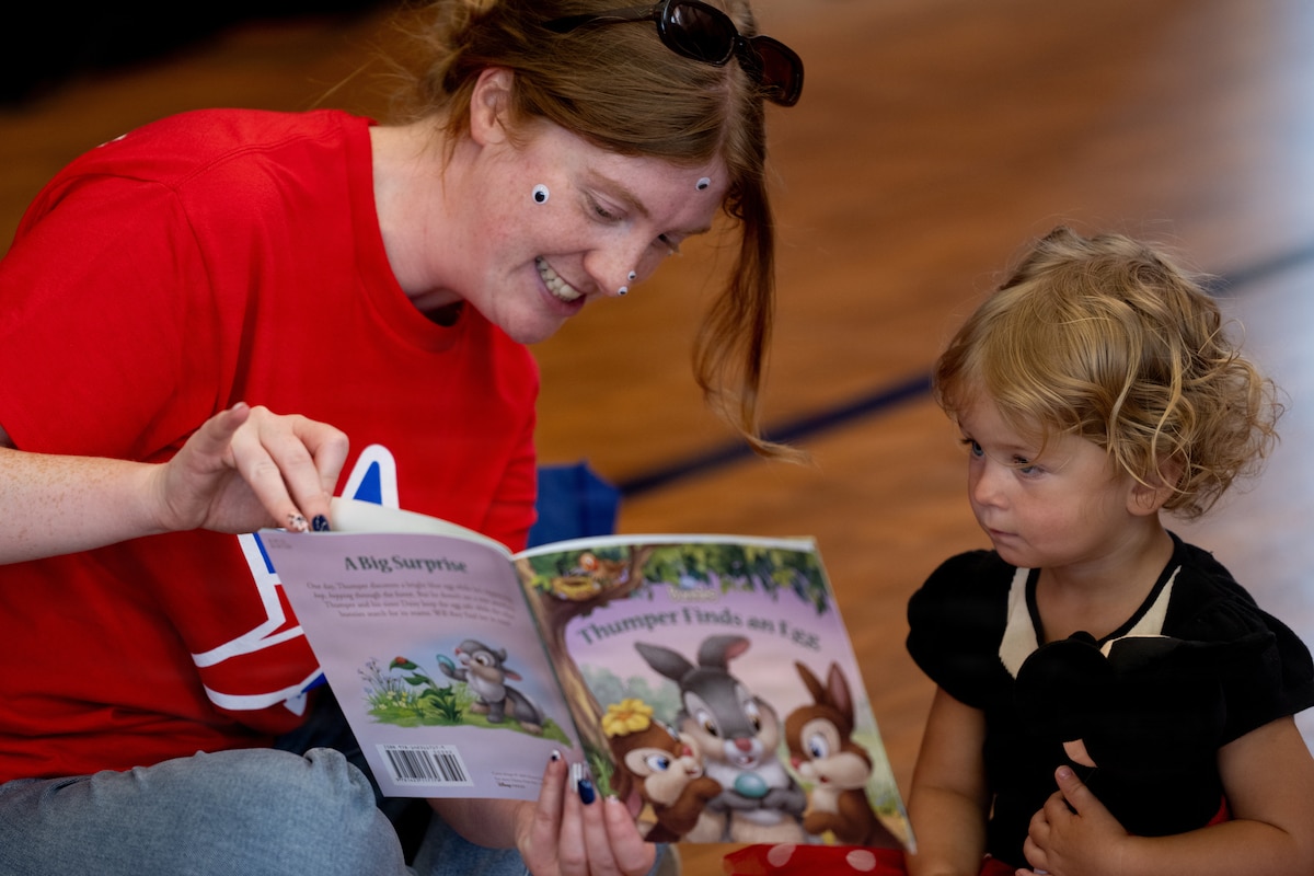 A Blue Star Families volunteer reads "Thumper Finds an Egg" to a military childduring a Blue Star Books event at MacDill Air Force Base, Florida, June 16, 2026. Hosted by Blue Star Families in collaboration with The Walt Disney Company, the event supported Vance’s 2026 Summer Reading Challenge. (U.S. Air Force photo by Airman 1st Class Nelvis Sera)