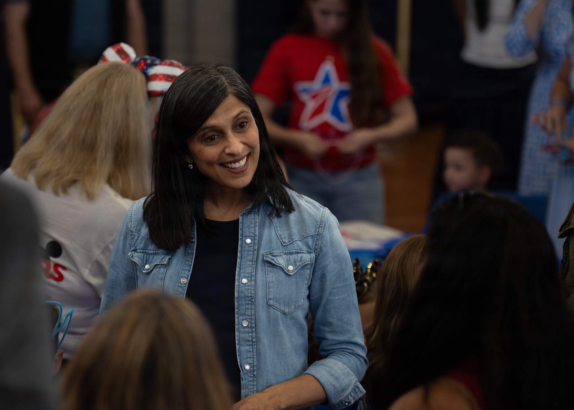 The Second Lady of the United States, Usha Vance, interacts with military families at MacDill Air Force Base, Florida, June 16, 2026. Vance visited the installation to participate in a Blue Star Books event hosted by Blue Star Families in collaboration with The Walt Disney Company. (U.S. Air Force photo by Airman 1st Class Nelvis Sera)