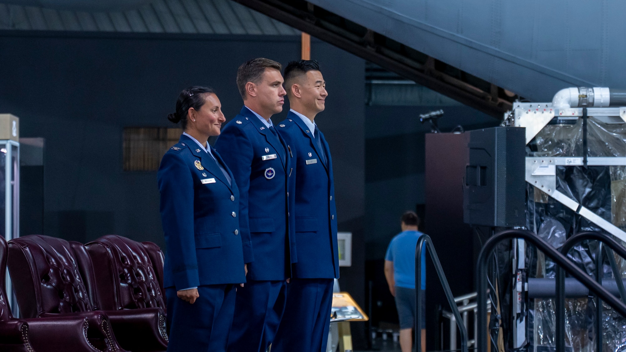 From left, Col. Zarine E. Malesra, Lt. Col. Nicholas Torroll and Lt. Col. Andrew Lee stand at attention during a change of command ceremony.