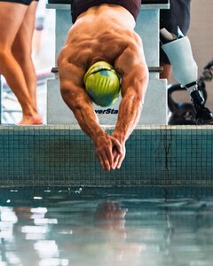 A Team Army competitor dives into the pool during a swimming training session for the 2026 Warrior Games in San Antonio, TX, June 10, 2026.