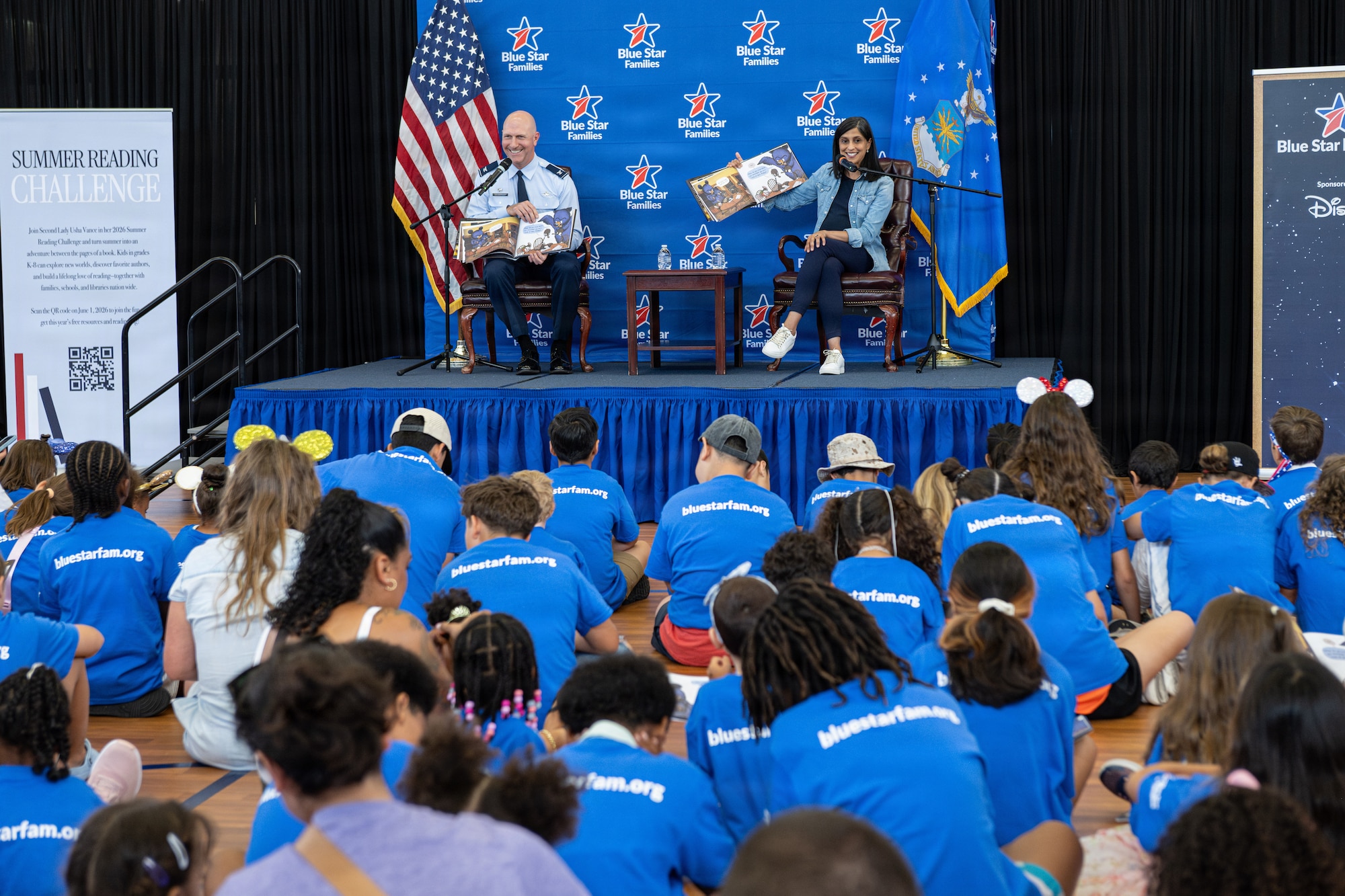 Second Lady of the United States Usha Vance reads a book to children.