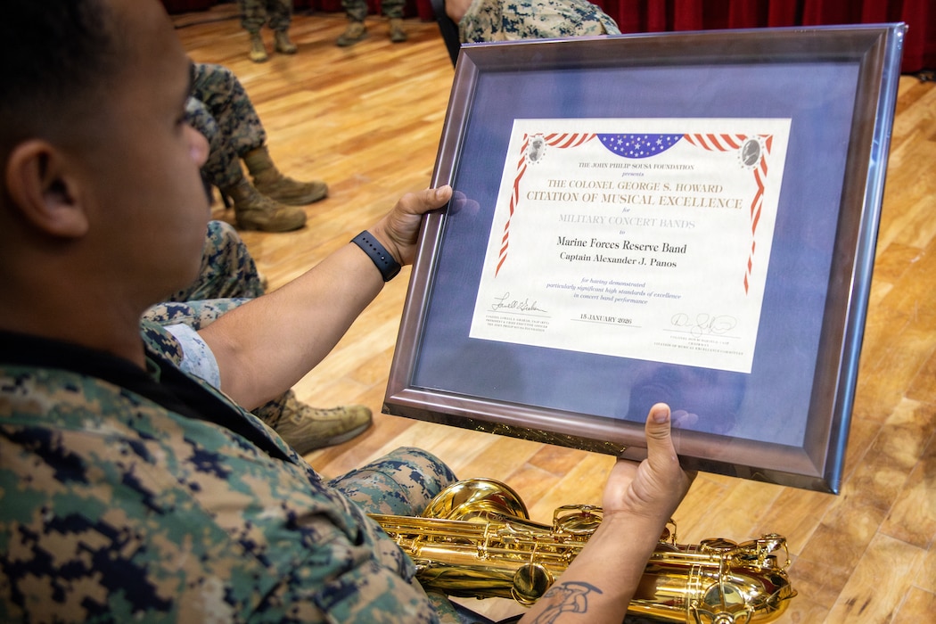 U.S. Marine Corps Sgt. Weston W. McCall, a french horn instrumentalist with Marine Forces Reserve Band, performs during an award ceremony held for the Marine Forces Reserve Band at Marine Forces Support Facility New Orleans, June 4, 2026. Each year only a select few military bands are presented with the Colonel George S. Howard Citation of Musical Excellence award, the highest honor a military concert band can receive. (U.S. Marine Corps photo by Lance Cpl. Nalanie Davila)