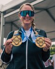 U.S. Army Maj. Mandy Feindt displays her gold medals after the cycling event during the 2026 Warrior Games in San Antonio.