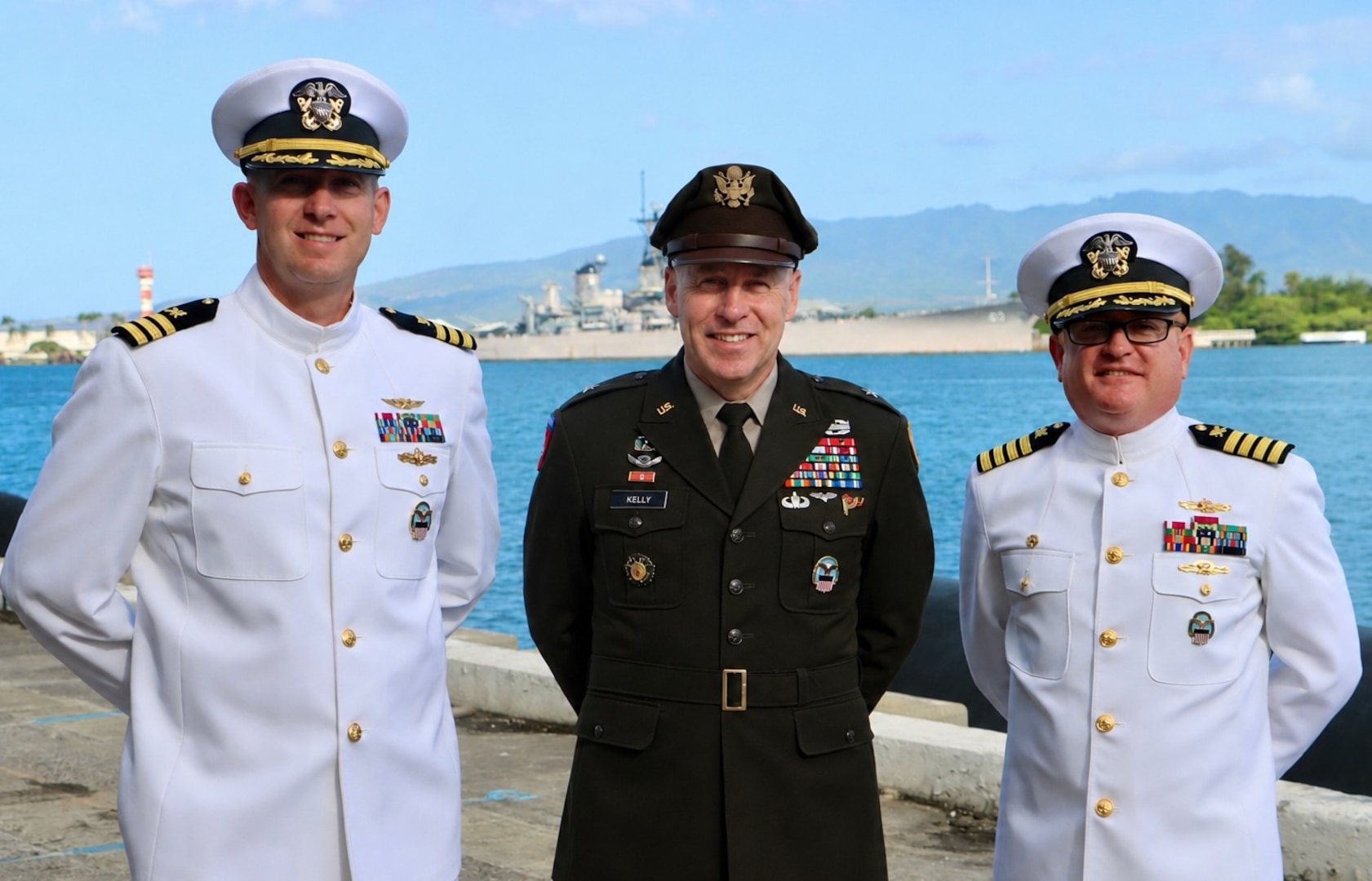 U.S. Army Brig. Gen. Sean P. Kelly, center, commander of Defense Logistics Agency Troop Support, stands with Navy Cmdr. Thomas Poe, right, incoming commander of DLA Troop Support Indo-Pacific, and Navy Capt. Ryan Cullinan, left, outgoing commander, during a group photo following the change of command ceremony on June 5, 2026. The ceremony formally marked the transition of leadership for DLA's vital Indo-Pacific supply and logistics mission. U.S. Navy photo by Wesley Burgos.