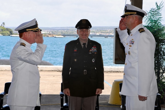 U.S. Navy Cmdr. Thomas Poe, right, incoming commander of Defense Logistics Agency Troop Support Indo-Pacific, and Navy Capt. Ryan Cullinan, left, outgoing commander, participate in a change of command ceremony as U.S. Army Brig. Gen. Sean P. Kelly, commander of DLA Troop Support, center, observes the traditional transfer of authority. The ceremony, held June 5, 2026, marks the formal relinquishment of command from Cullinan to Poe. DLA Troop Support Indo-Pacific provides comprehensive logistics, supply, and support services to joint warfighters across the Pacific theater. U.S. Navy photo by Wesley Burgos, public affairs specialist, NAVSUP FLC Pearl Harbor.