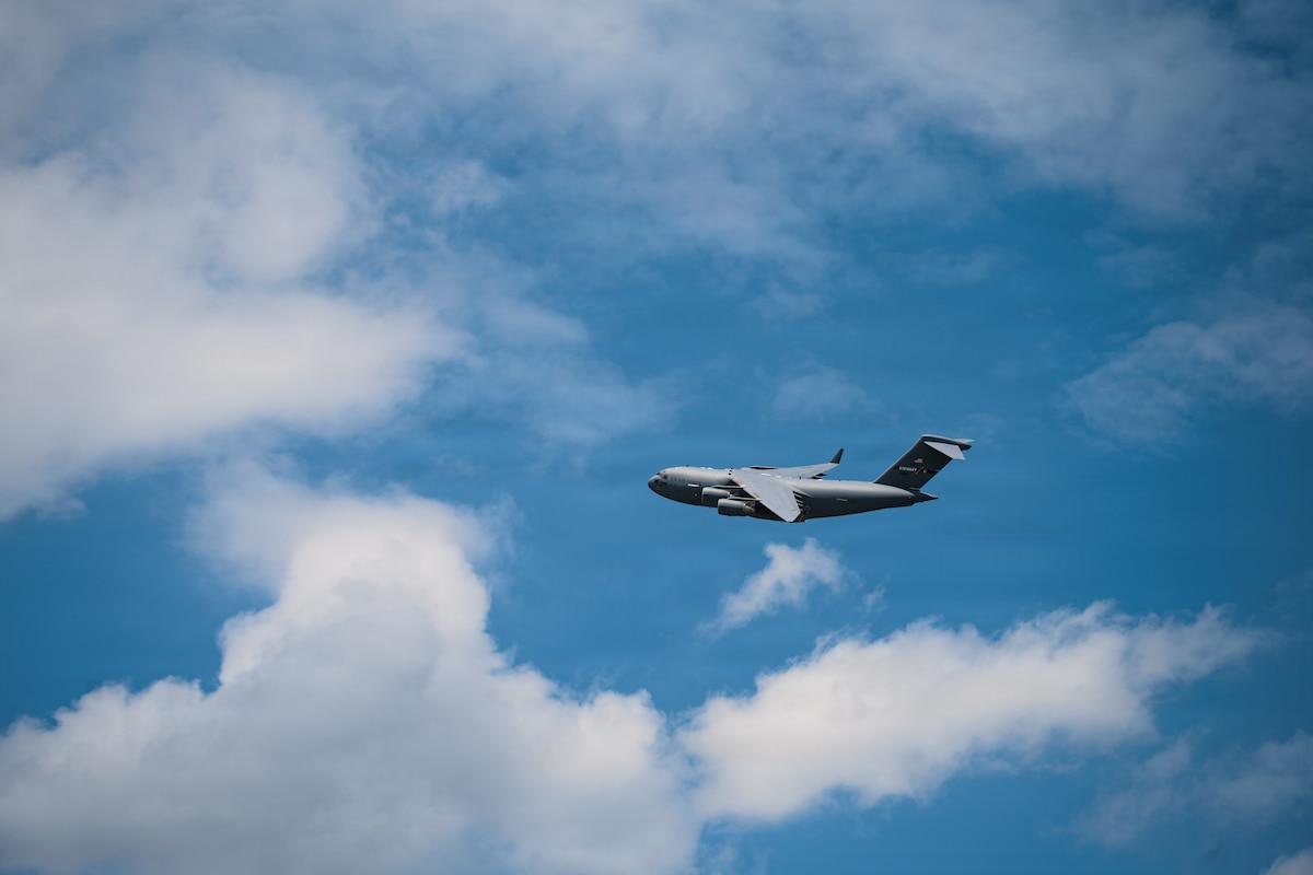 A C-17 flies in the air.