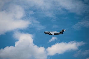 A C-17 flies in the air.