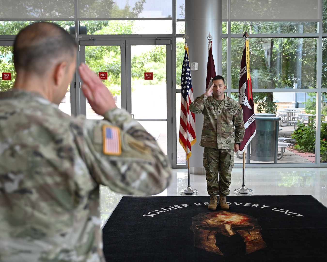 Lt. Col. Michael Finch salutes Col. Mark Jacques as he assumes command of the Fort Hood Soldier Recovery Unit during a change of command ceremony at Carl R. Darnall Army Medical Center. Finch takes leadership of the unit responsible for guiding wounded, ill, and injured Soldiers through recovery and transition.