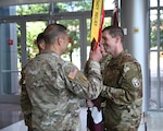 Col. Mark Jacques, commander of Carl R. Darnall Army Medical Center, receives the guidon from outgoing Soldier Recovery Unit commander Lt. Col. John Burns during a change of command ceremony at CRDAMC on June 18. The passing of the guidon symbolizes the transfer of authority and responsibility.