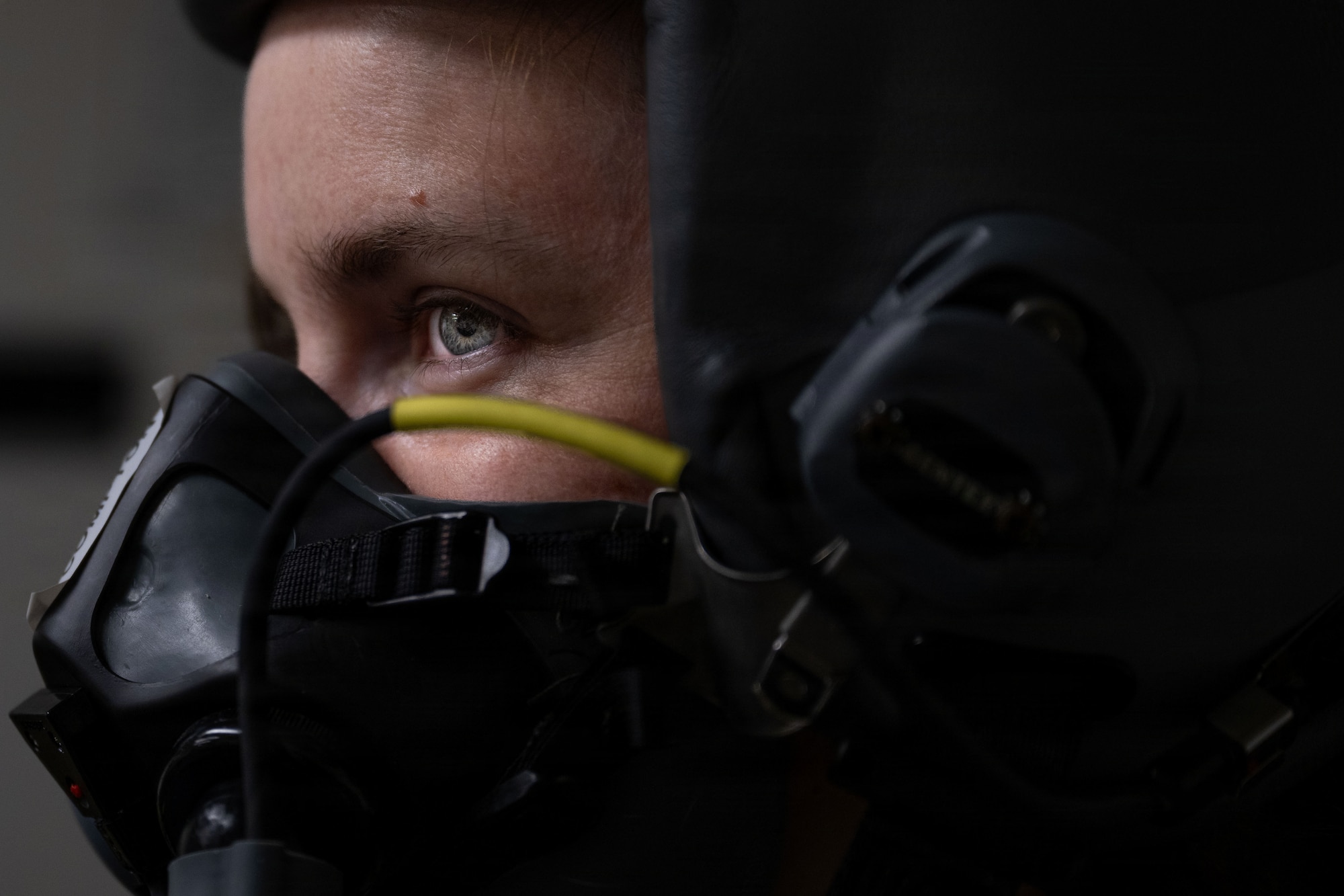 Very close on a woman with a helmet and mask on.