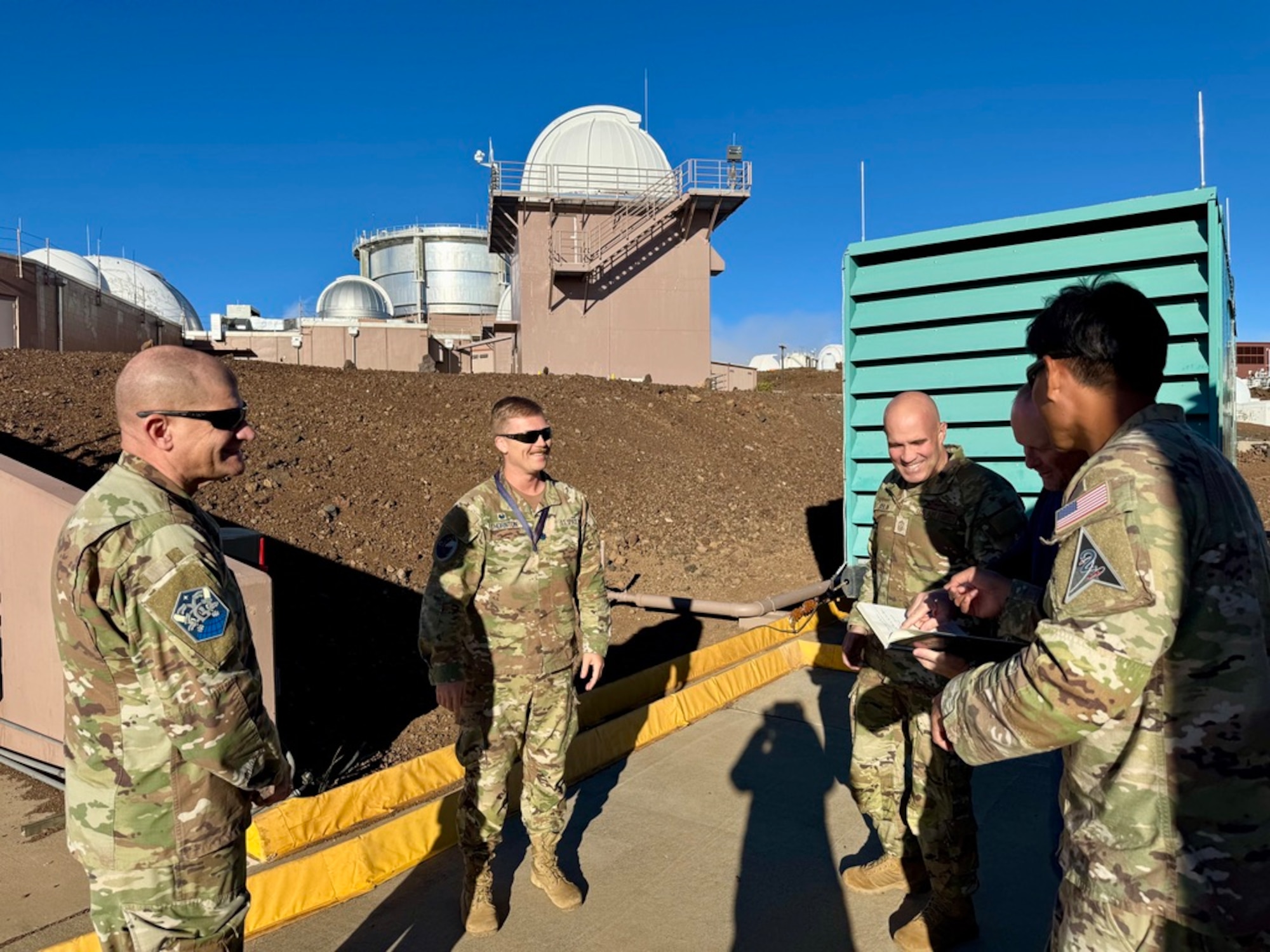 Group of service members talking in Maui, Hawaii.