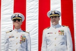 Capt. Corey Braddock stands beside Capt. Joseph Graham
