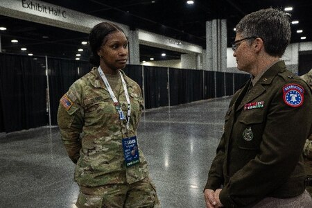 Brig Gen Sara Dudley, USARD commanding general speaking with U.S. Army Soldier at SkillsUSA