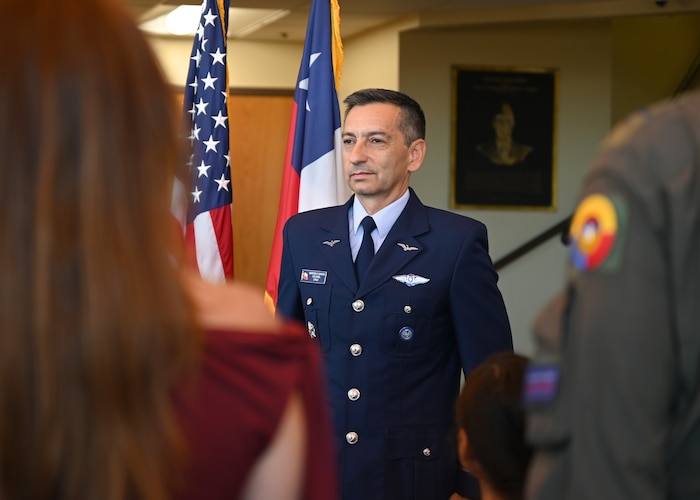 Chilean air force Col. Marcelo Garcia, System of Cooperation Among the American Air Forces (SICOFAA) undersecretary general, stands at attention as his Air Force Meritorious Service Medal citation is read during a ceremony at 12th Air Force, Air Forces Southern (AFSOUTH) headquarters on Davis-Monthan Air Force Base, Arizona, June 5, 2026. SICOFAA brings together air forces from across North, Central, and South America to strengthen cooperation, interoperability, and regional partnerships through recurring engagements, exercises and professional exchanges. (U.S. Air Force photo by Staff Sgt. Abbey Rieves)