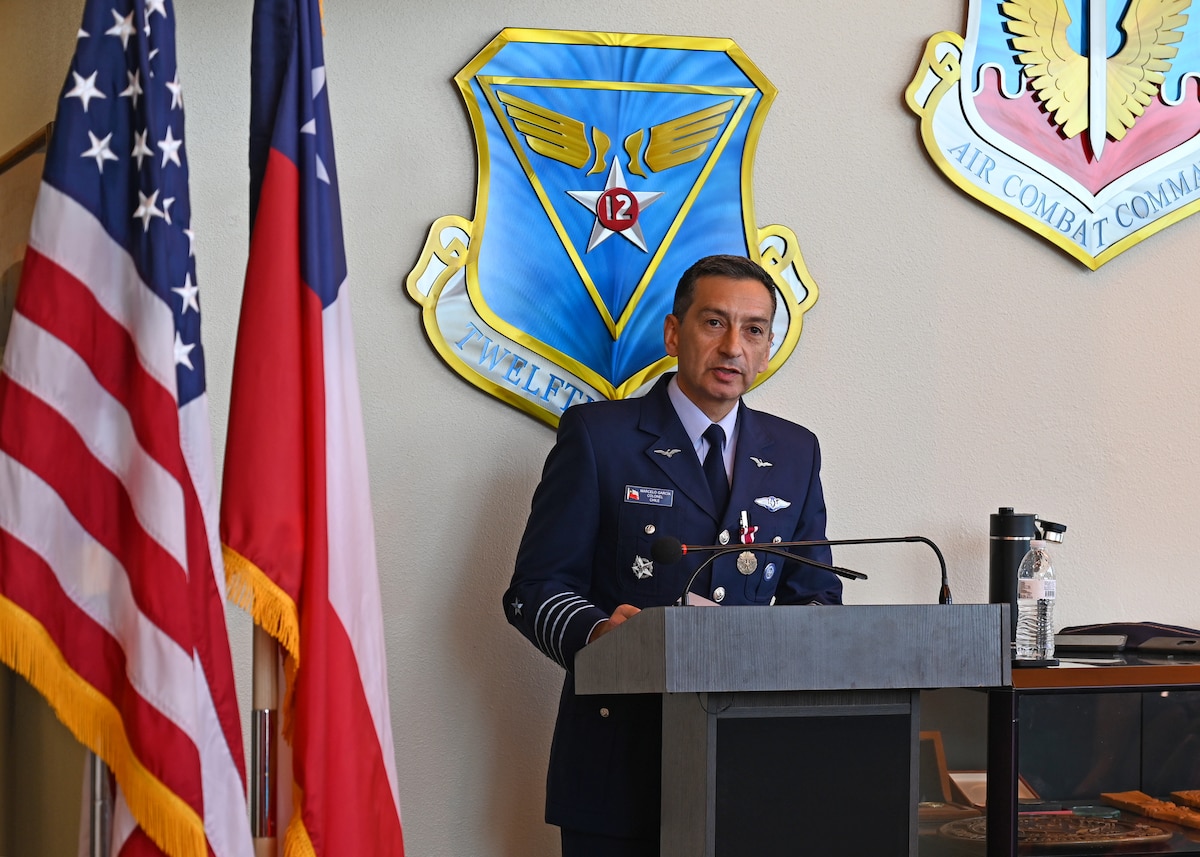 Chilean air force Col. Marcelo Garcia, System of Cooperation Among the American Air Forces (SICOFAA) undersecretary general, delivers remarks during his Air Force Meritorious Service Medal presentation ceremony at 12th Air Force, Air Forces Southern (AFSOUTH) headquarters, on Davis-Monthan Air Force Base, Arizona, June 5, 2026. Garcia reflected on the relationships built through SICOFAA and the role those connections play in enabling air forces across the hemisphere to respond more effectively to shared challenges. (U.S. Air Force photo by Staff Sgt. Abbey Rieves)