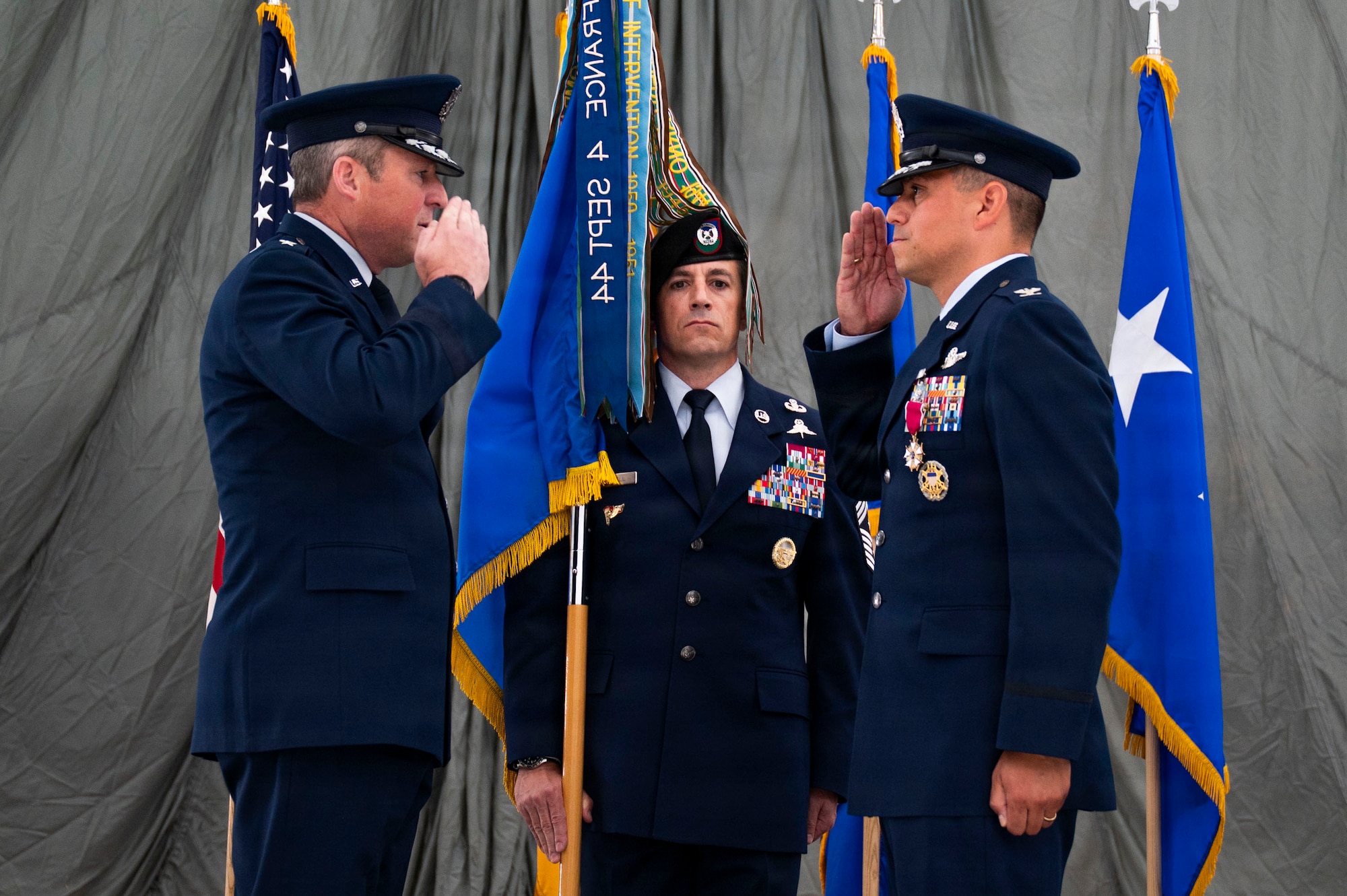 U.S. Air Force Lt. Gen. Mike Conley, left, commander of Air Force Special Operations Command, receives a salute from U.S. Air Force Col. Brett Cassidy, right, 27th Special Operations Wing commander, during a change of command ceremony at Cannon Air Force Base, New Mexico, June 18, 2026. Conley facilitated the transfer of command from Col. Robert Johnston, 27th SOW outgoing commander, to Cassidy, 27th SOW incoming commander. (U.S. Air Force photo by Staff Sgt. Corinna Morlan)