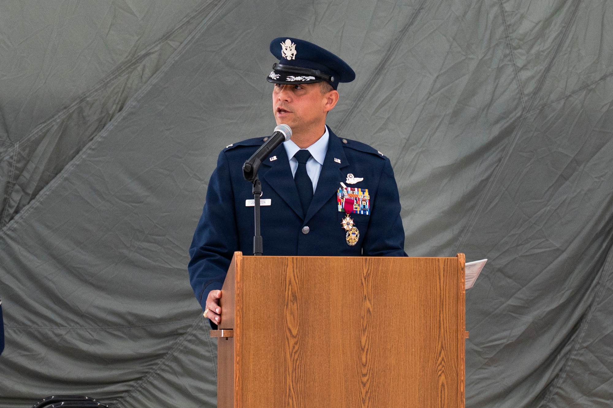 U.S. Air Force Col. Robert Johnston, 27th Special Operations Wing outgoing commander, gives remarks during a change of command ceremony, Cannon Air Force Base, New Mexico, June 18, 2026. While serving as commander of the 27th SOW, Johnston led the wing through a historic number of crisis response operations and combat deployments, oversaw the establishment of a new Combat Arms Training and Maintenance facility, tripling the size of the previous facility, and expanded access to specialty medical care. (U.S. Air Force photo by Staff Sgt. Corinna Morlan)
