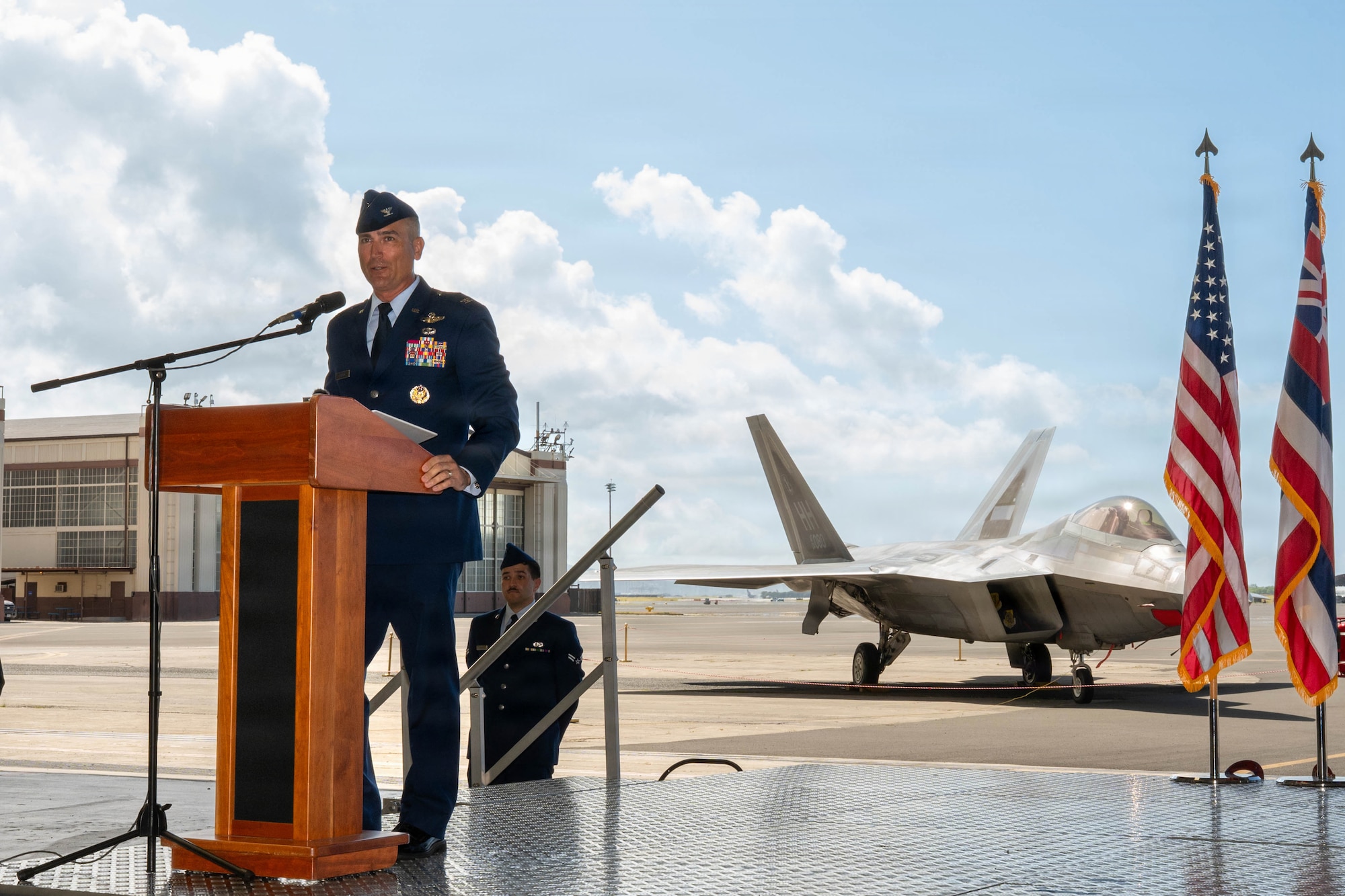 U.S. Air Force  Col. Kyle Clinton, incoming 15th Wing commander, addresses the audience during the wing change of command ceremony at Joint Base Pearl Harbor-Hickam, Hawaii, June 18, 2026. The 15th Wing's mission is to project and sustain airpower throughout the Pacific and defend the homeland. (U.S. Air Force photo by Senior Airman Lauren Torres)