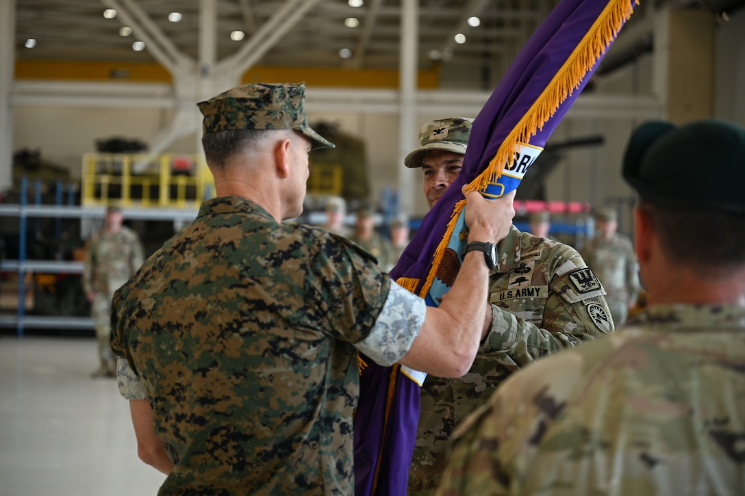 U.S. Marine Gen. Francis Donovan, commander of U.S. Southern Command, passes the Joint Task Force-Bravo guidon to U.S. Army Col. David Webb during the JTF-Bravo change of command and responsibility ceremony at Soto Cano Air Base, Honduras, June 18, 2026. The passing of the guidon represents the passing of command from the outgoing to incoming commander. (U.S. Air Force photo by Staff. Sgt. Ethan Sherwood)