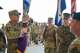 U.S. Army Command Sgt. Maj. Thomas West, Joint Task Force-Bravo senior enlisted leader, holds the Joint Task Force-Bravo guidon during the JTF-Bravo change of command and responsibility ceremony at Soto Cano Air Base, Honduras, June 18, 2026. West assumed responsibility of JTF-Bravo and will serve alongside Col. David Webb, JTF-Bravo commander, leading the task force into the next chapter. (U.S. Air Force photo by Staff Sgt. Ethan Sherwood)