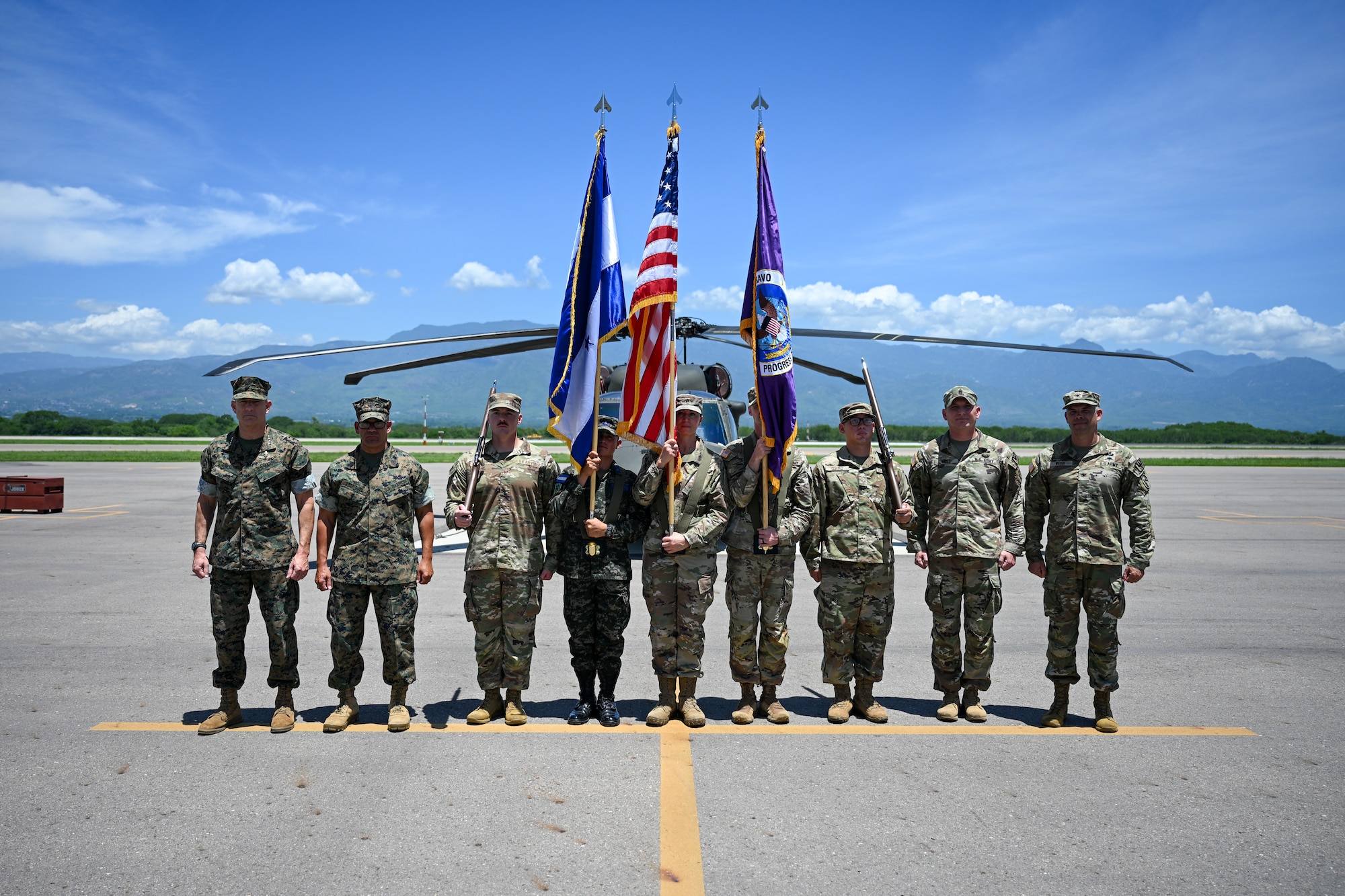 The U.S. Southern Command leadership team and Joint Task Force-Bravo command team take a photo with the joint color guard during the JTF-Bravo change of command and responsibility ceremony at Soto Cano Air Base, Honduras, June 18, 2026. Col. David Webb and Command Sgt. Maj. Thomas West will lead JTF-Bravo for the next year’s operations and missions. (U.S. Air Force photo by Staff Sgt. Ethan Sherwood)