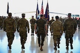 U.S. Marine Gen. Francis Donovan, commander of U.S. Southern Command, and the Joint Task Force-Bravo command team prepare to pass the guidon during the JTF-Bravo change of command and responsibility ceremony at Soto Cano Air Base, Honduras, June 18, 2026. Donovan acted as the presiding officer for the change of command. The ceremony concluded his first visit to Honduras since assuming command. (U.S. Air Force photo by Staff Sgt. Ethan Sherwood)