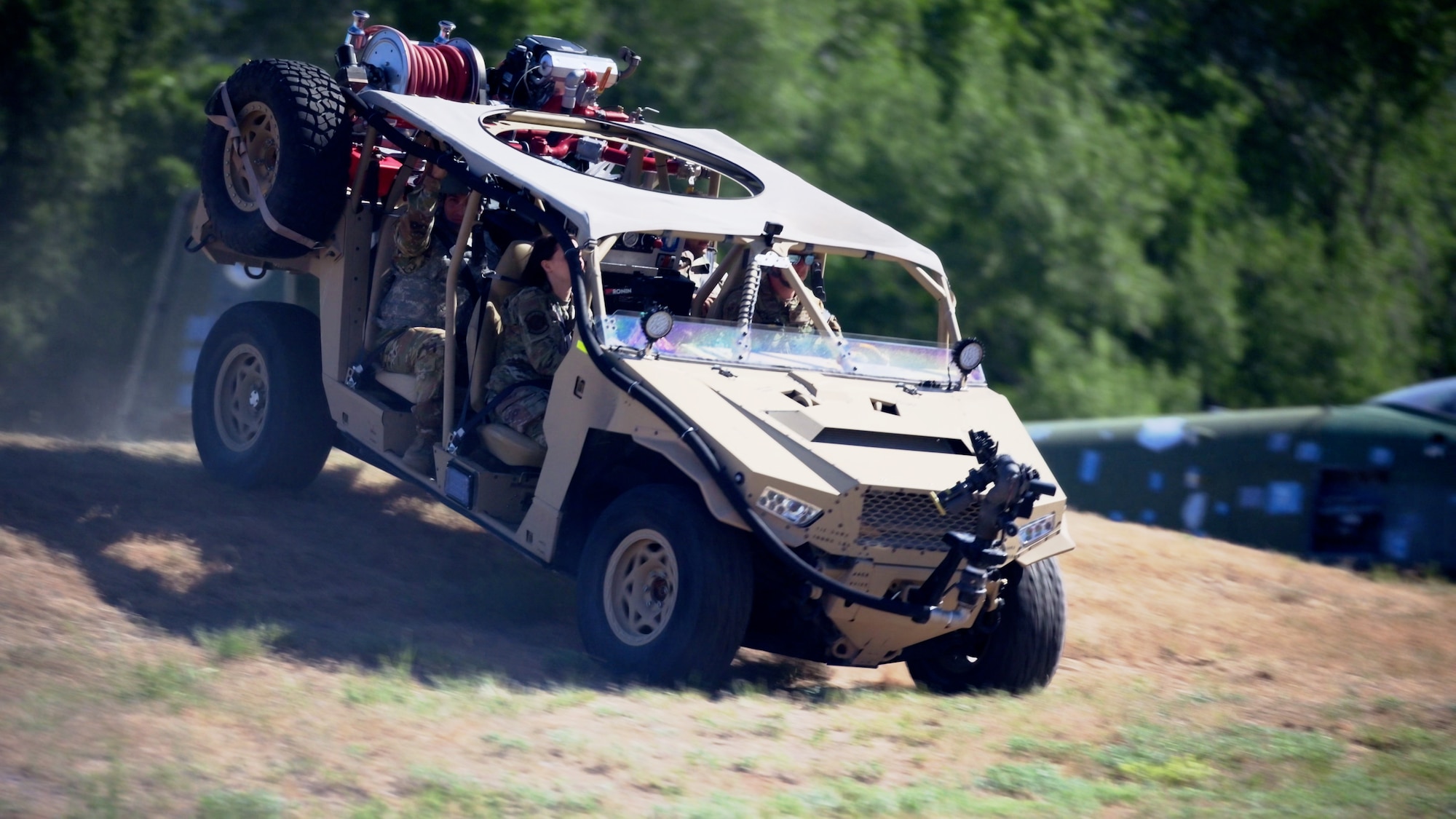 the MARK 1 descends a steep grassy hill.