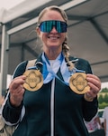 U.S. Army Maj. Mandy Feindt displays her gold medals after the cycling event during the 2026 Warrior Games in San Antonio, Texas, June 14, 2026. The 2026 Warrior Games takes place June 13-20 in San Antonio, Texas, bringing together nearly 200 wounded, ill and injured service members and veterans from the U.S. Army, Marine Corps, Navy/Coast Guard, Air Force/Space Force, and U.S. Special Operations Command to compete across multiple adaptive sports. (U.S. Army photo by Spc. Jose Rolando Garcia)