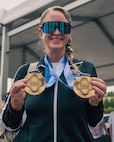U.S. Army Maj. Mandy Feindt displays her gold medals after the cycling event during the 2026 Warrior Games in San Antonio.