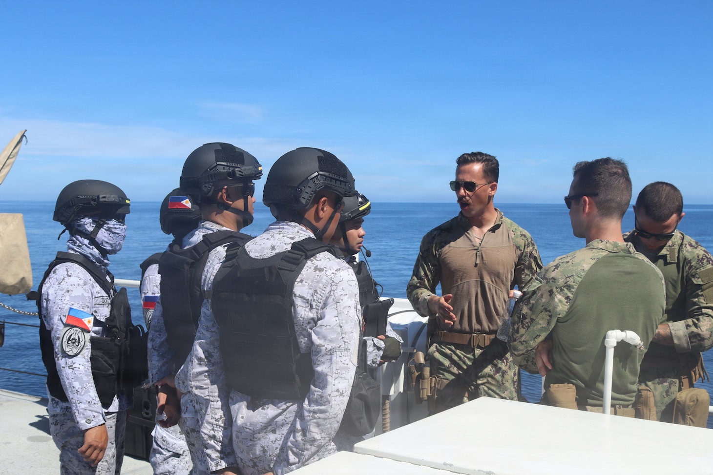 Members of the Armed Forces of the Philippines and U.S. Coast Guardsmen conduct small-boat training aboard Sentinel-class fast response cutter USCGC Charles Moulthrope (WPC 1141) during a Maritime Cooperative Activity. U.S. 7th Fleet routinely operates with the Armed Forces of the Philippines and partners and allies through MCAs to continually develop, exercise and enhance multi-domain tactical interoperability to uphold peace and security in the region. (Courtesy photo by U.S. Coast Guard)