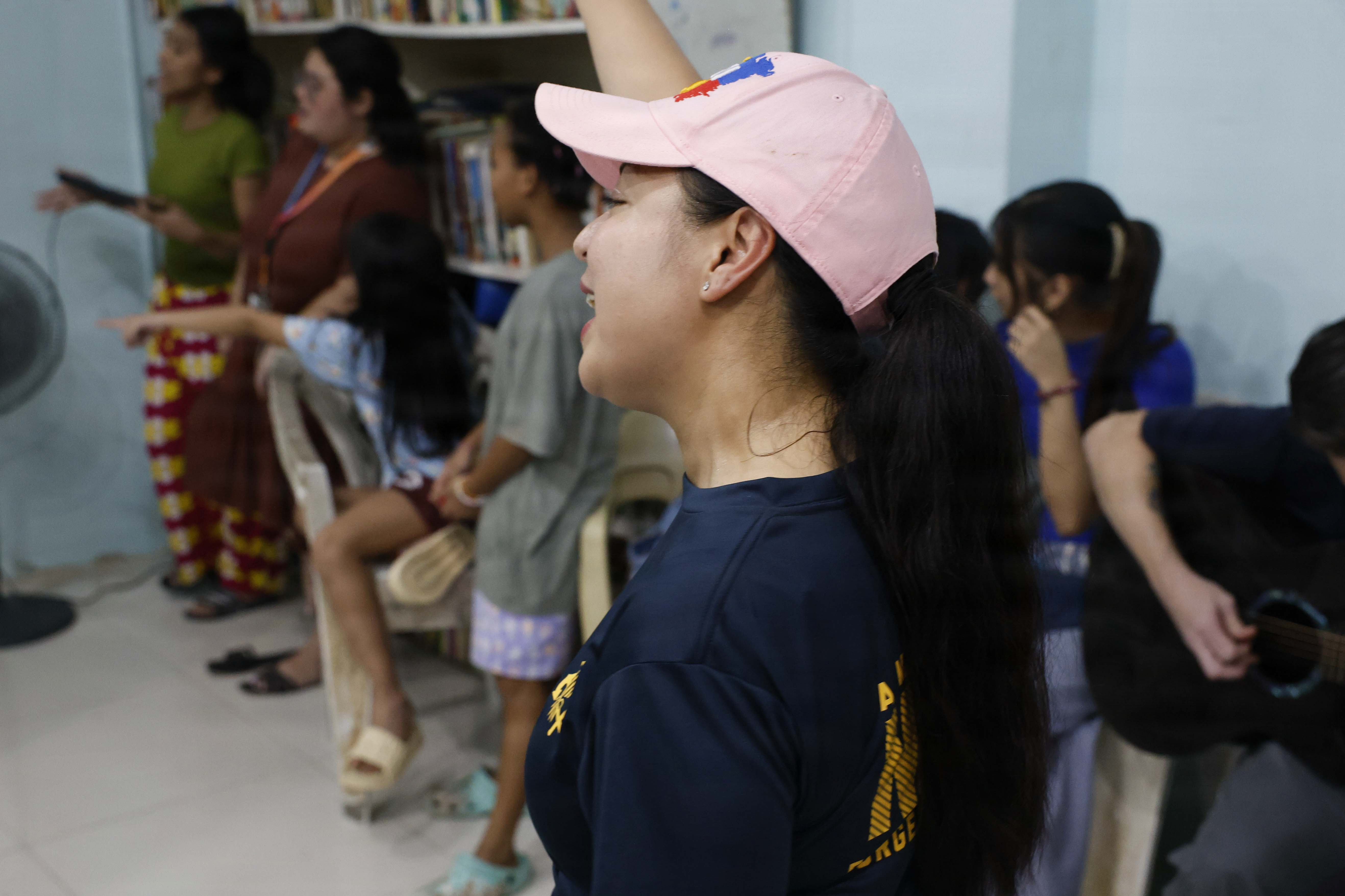OLONGAPO CITY, Philippines (June 12, 2026) – U.S. Navy Chief Logistics Specialist Rhona Dumlao, assigned to Pacific Partnership 2026 (PP26), sings with children during a PP26 community outreach and engagement event at the Olongapo Social Development Center in Olongapo City, Philippines, June 12, 2026.