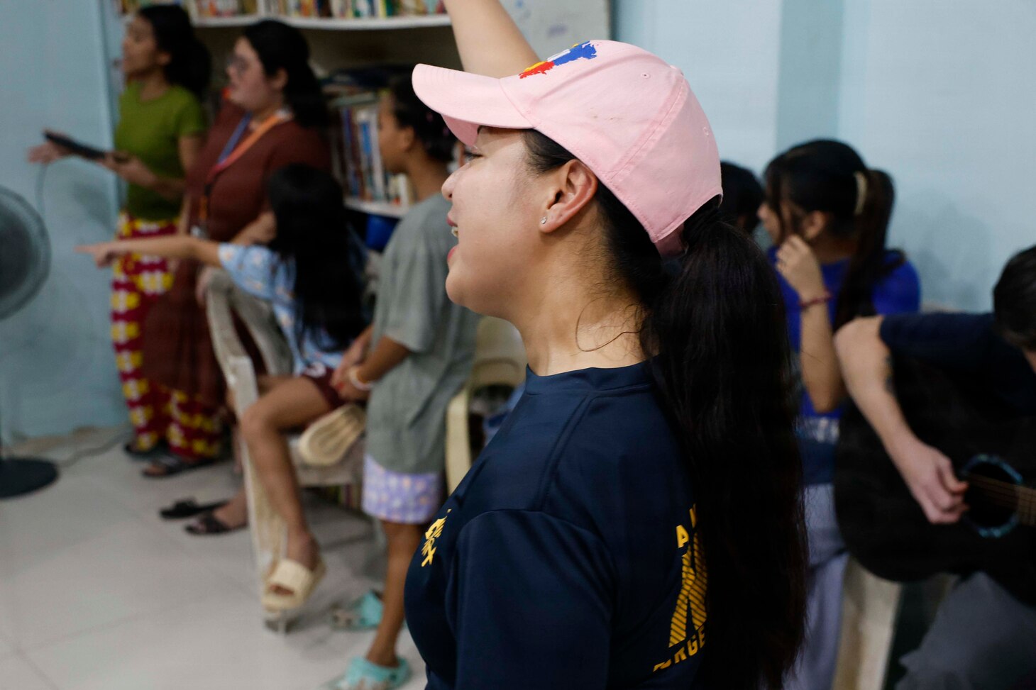 OLONGAPO CITY, Philippines (June 12, 2026) – U.S. Navy Chief Logistics Specialist Rhona Dumlao, assigned to Pacific Partnership 2026 (PP26), sings with children during a PP26 community outreach and engagement event at the Olongapo Social Development Center in Olongapo City, Philippines, June 12, 2026.
