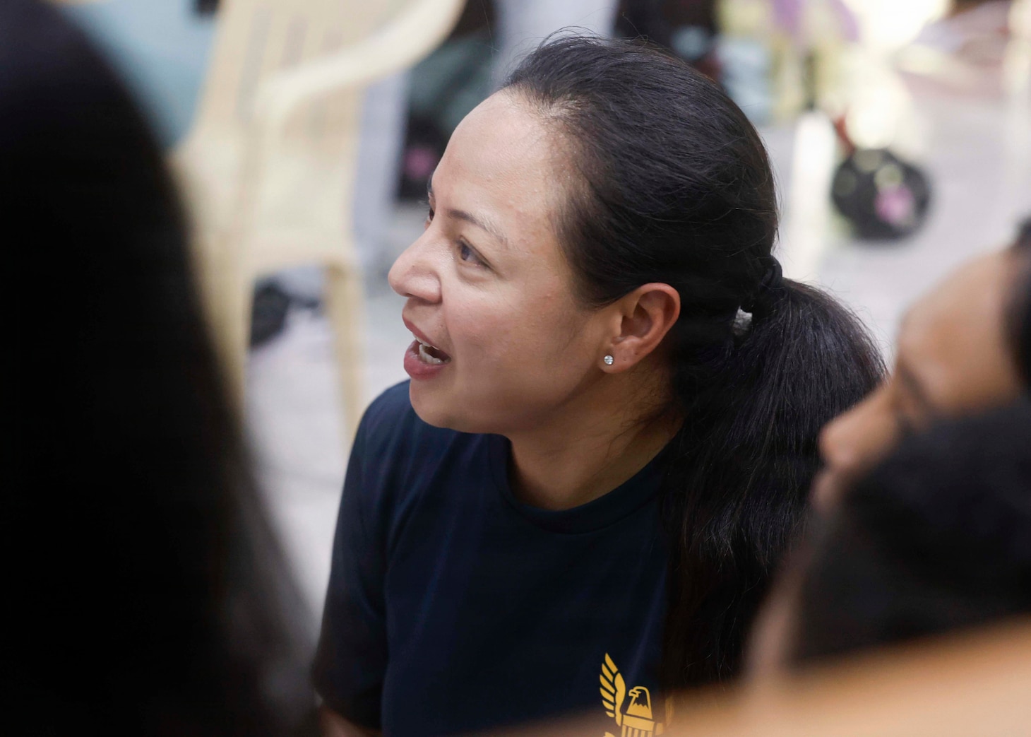 OLONGAPO CITY, Philippines (June 12, 2026) – U.S. Navy Chief Logistics Specialist Rhona Dumlao, assigned to Pacific Partnership 2026 (PP26), sings with children during a PP26 community outreach and engagement event at the Olongapo Social Development Center in Olongapo City, Philippines, June 12, 2026.