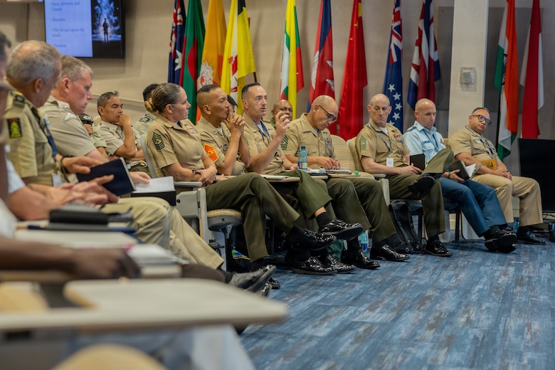 U.S. Marine Corps Sgt. Maj. Christopher J. Adams, center, the command senior enlisted leader of III Marine Expeditionary Force, speaks at the Pacific Amphibious Leaders Symposium 2026 in Honolulu, Hawaii, June 16, 2026. Bringing together experts and leaders from across the Indo-Pacific, PALS fosters collaboration among allied and partner amphibious and maritime forces to share knowledge and recent operational insights. This year marked the 12th iteration of the symposium, hosting senior leaders from 25 participating nations committed to a free and open Indo-Pacific, with the objective of strengthening and developing regional relationships. (U.S. Marine Corps photo by Lance Cpl. Jose Villasenor)