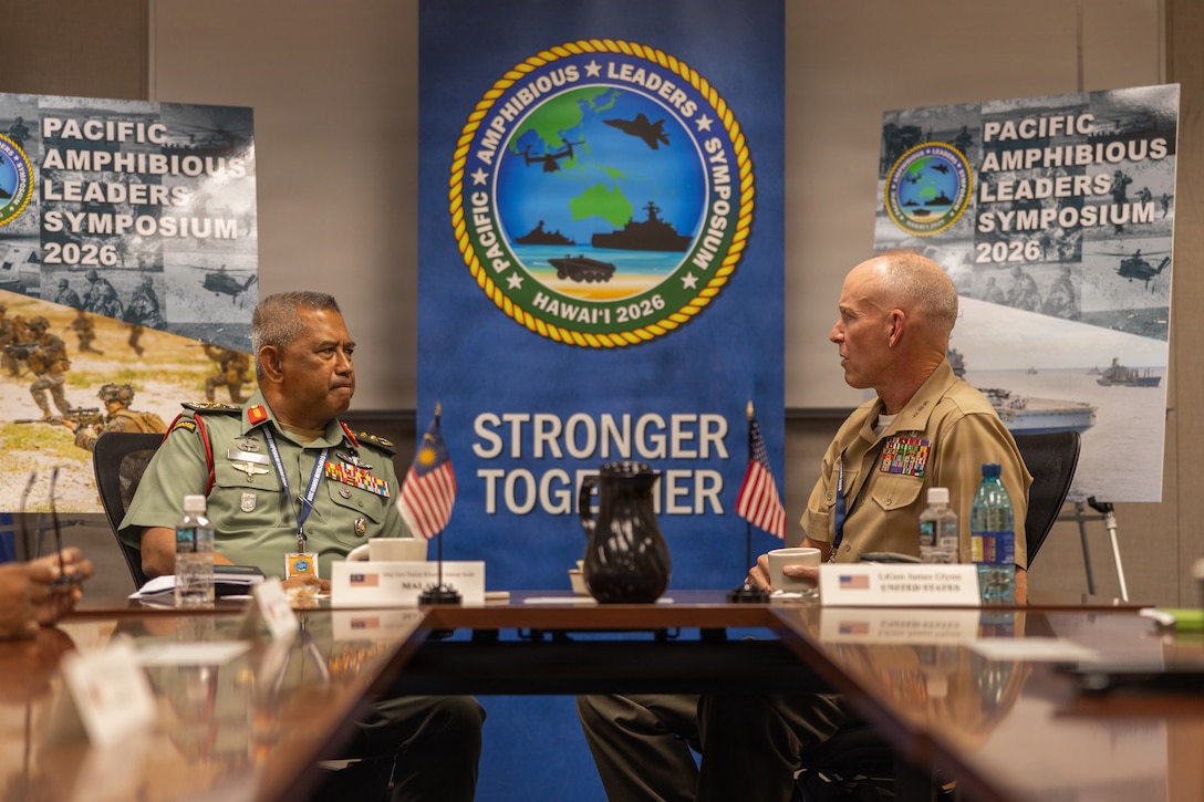 Malaysian Army Maj. Gen. Datuk Khairul Anwar bin Soib, left, the commander of 10th Parachute Brigade, speaks with U.S. Marine Corps Lt. Gen. James F. Glynn, right, the commander of U.S. Marine Corps Forces, Pacific, during a key leader engagement at the Pacific Amphibious Leaders Symposium 2026 in Honolulu, Hawaii, June 16, 2026. Bringing together experts and leaders from across the Indo-Pacific, PALS fosters collaboration among allied and partner amphibious and maritime forces to share knowledge and recent operational insights. This year was the 12th iteration of the symposium and hosted senior leaders from 25 participating nations who are committed to a free and open Indo-Pacific, with the objective of strengthening and developing regional relationships. (U.S. Marine Corps photo by Lance Cpl. Blake Gonter)